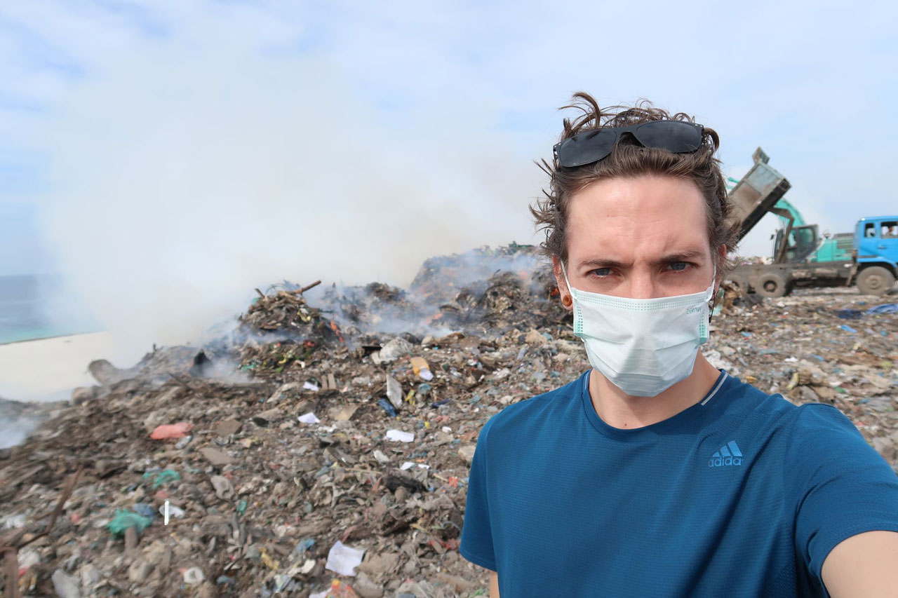 Man in a open dumpsite