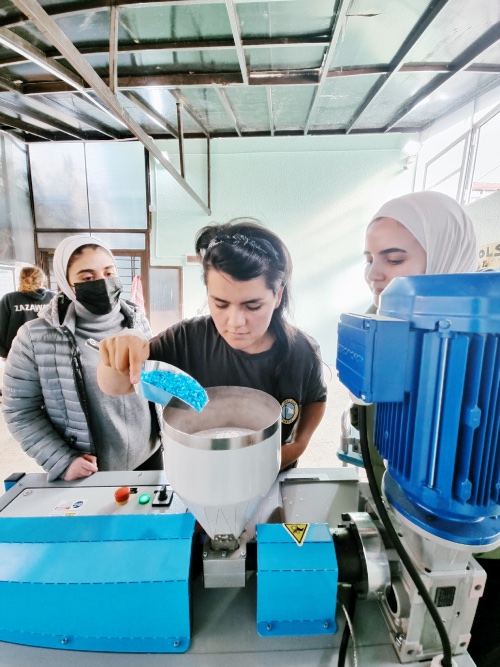 Three jordan women recycling plastic