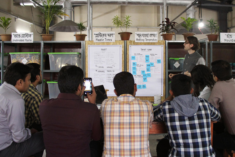 Group of people being trained about plastic recycling